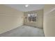 Cozy bedroom features plush carpeting, neutral paint, and a sunny window for natural light at 18142 E Oakwood Pl, Aurora, CO 80016
