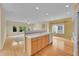 Spacious kitchen with white countertops, stainless steel appliances, and hardwood floors throughout at 18142 E Oakwood Pl, Aurora, CO 80016