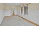 Living room with wall paneling, large window and carpet flooring at 18142 E Oakwood Pl, Aurora, CO 80016
