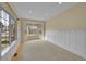 Inviting living room with wall paneling, carpet, bay window, and natural light at 18142 E Oakwood Pl, Aurora, CO 80016
