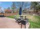 Landscaped backyard with outdoor patio furniture and well-maintained lawn at 9250 Roadrunner Dr, Highlands Ranch, CO 80129