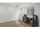 Finished basement office space setup, featuring a window with natural light, carpet flooring, and an adjustable office chair at 9250 Roadrunner Dr, Highlands Ranch, CO 80129