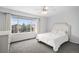 Bright bedroom featuring a large window and neutral decor at 9250 Roadrunner Dr, Highlands Ranch, CO 80129