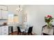 Charming dining area featuring a glass table, modern chairs, and natural light at 972 S Zeno Way, Aurora, CO 80017