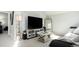 Spacious living room with modern furniture, large TV, and decorative shelving at 972 S Zeno Way, Aurora, CO 80017