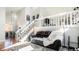 Open-concept living area with a loft, featuring a comfortable sofa and neutral decor at 972 S Zeno Way, Aurora, CO 80017