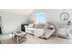 Bright living room features a comfortable couch, accent table and natural light from the large window at 972 S Zeno Way, Aurora, CO 80017
