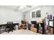 Storage area, featuring a desk, many boxes, and a window that provides natural light at 972 S Zeno Way, Aurora, CO 80017