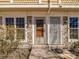 Inviting front entrance with stone accents, decorative door, and welcoming 'hello' mat at 1247 S Idalia St, Aurora, CO 80017