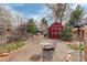 Cozy backyard featuring a red shed, an outdoor seating area, and a charming pergola at 124 E Colorado Ave # 2, Denver, CO 80210