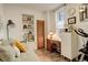 Charming bedroom with built-in shelving, a work space, and a comfortable daybed at 124 E Colorado Ave # 2, Denver, CO 80210