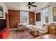 Inviting living room with exposed brick, hardwood floors, and modern decor at 124 E Colorado Ave # 2, Denver, CO 80210