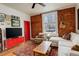 Cozy living room features exposed brick, hardwood floors, and comfortable seating at 124 E Colorado Ave # 2, Denver, CO 80210