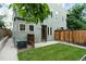 Charming backyard with green grass, privacy fence, and a well-maintained lawn at 4544 Utica St, Denver, CO 80212