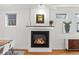 Elegant fireplace with modern black trim, complemented by neutral walls and hardwood flooring at 4544 Utica St, Denver, CO 80212