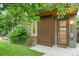 Stylish townhouse with an attractive wood-paneled front door and modern exterior lighting at 4544 Utica St, Denver, CO 80212