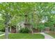 Charming multi-level townhouse with a well-maintained front yard and beautiful, mature shade trees at 4544 Utica St, Denver, CO 80212