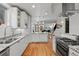Bright kitchen with stainless appliances and granite countertops extending to the dining area at 4544 Utica St, Denver, CO 80212
