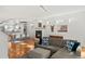 Spacious living area with a modern fireplace, sofa, and open dining area at 4544 Utica St, Denver, CO 80212