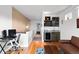 Stylish living room with hardwood floors, a wet bar, and comfortable seating area with bright light at 4544 Utica St, Denver, CO 80212