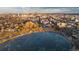 Aerial view featuring a Denver skyline, park with a frozen lake, and surrounding neighborhood at 1259 Perry St, Denver, CO 80204