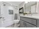 Clean bathroom with tub, shower, modern vanity and updated finishes at 1259 Perry St, Denver, CO 80204