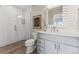 Modern bathroom with a sleek glass-enclosed shower, white subway tile, and stylish vanity at 1259 Perry St, Denver, CO 80204