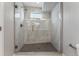 Modern bathroom featuring a glass door shower and marble-like tiling at 1259 Perry St, Denver, CO 80204