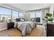 Sunlit bedroom featuring large windows and stylish decor at 1259 Perry St, Denver, CO 80204