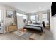 Bright bedroom featuring a bed, carpet flooring, natural light and balcony at 1259 Perry St, Denver, CO 80204