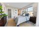 Bedroom featuring a large window, neutral decor, and carpeted floors at 1259 Perry St, Denver, CO 80204