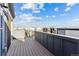 Rooftop deck with views of a modern urban neighborhood under a bright blue sky with scattered clouds at 1259 Perry St, Denver, CO 80204