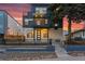 Beautiful modern home with a private balcony, professional landscaping, and cozy outdoor lighting at 1259 Perry St, Denver, CO 80204