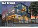 Striking modern home with a multi-level design, private balconies, and inviting outdoor lighting at 1259 Perry St, Denver, CO 80204