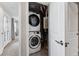 Conveniently located laundry area features a stackable washer and dryer, maximizing space and efficiency at 1259 Perry St, Denver, CO 80204