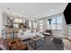 Open concept living area with stylish decor, kitchen bar, and easy access to stairs at 1259 Perry St, Denver, CO 80204