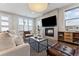 Comfortable living room features a fireplace, television, seating, and stylish decor at 1259 Perry St, Denver, CO 80204