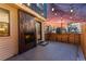 Outdoor patio with modern fireplace, string lights, and wooden fence, perfect for evening relaxation at 1259 Perry St, Denver, CO 80204