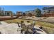 Spacious backyard with a patio set, grass area, and attractive landscaping and fencing at 7506 Sabino Ln, Castle Rock, CO 80108