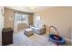 Bedroom with neutral walls and carpet features a window with curtains, furniture, and a trampoline at 7506 Sabino Ln, Castle Rock, CO 80108