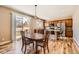 Bright kitchen with wood floors, granite countertops, and stainless steel appliances at 7506 Sabino Ln, Castle Rock, CO 80108