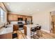 Well-lit kitchen with granite countertops, stainless steel appliances, and wood floors at 7506 Sabino Ln, Castle Rock, CO 80108