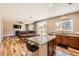 Open concept kitchen with stainless appliances, granite countertops, and an island at 7506 Sabino Ln, Castle Rock, CO 80108