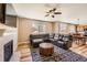 Inviting living room with cozy seating, fireplace, hardwood floors, and great natural light at 7506 Sabino Ln, Castle Rock, CO 80108
