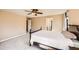 Bright main bedroom features neutral walls, neutral carpet, and a traditional-style bed with a white comforter at 7506 Sabino Ln, Castle Rock, CO 80108