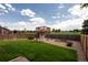 The expansive backyard has a lush lawn, a charming treehouse, and gravel landscaping at 11381 Jay St, Westminster, CO 80020
