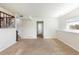 Spacious basement with carpeted flooring, window, and staircase to the upper level at 11381 Jay St, Westminster, CO 80020