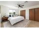 Comfortable bedroom with neutral decor, large windows, ceiling fan and ample closet space at 11381 Jay St, Westminster, CO 80020