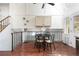 Cozy dining area with a black table, four chairs, and unique wall decor at 11381 Jay St, Westminster, CO 80020