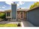 Charming front entrance with stone accents, well-maintained landscaping and attractive color scheme at 11381 Jay St, Westminster, CO 80020
